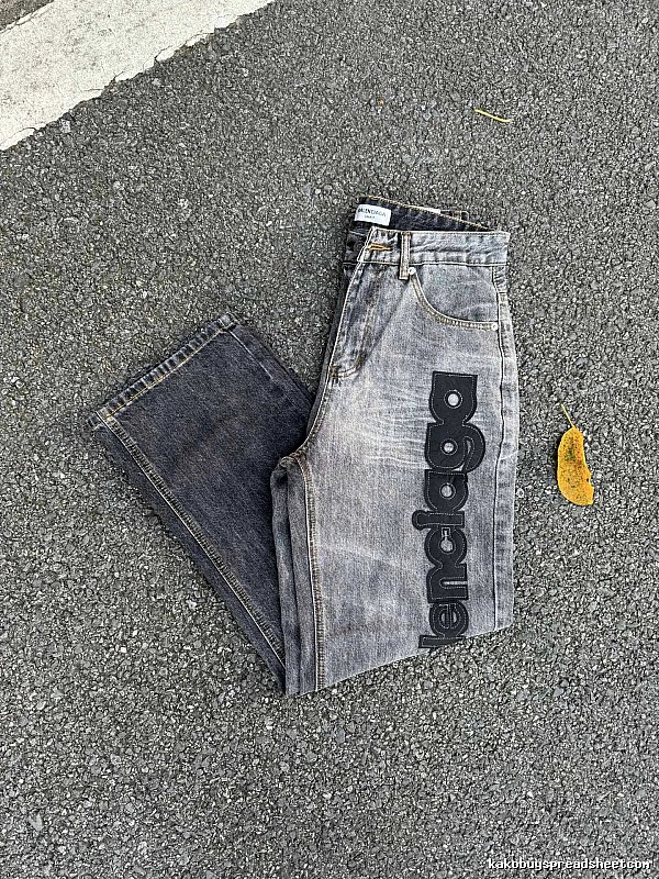 Balenciaga Logo Jeans with large side script branding and a faded leg in Gray Wash