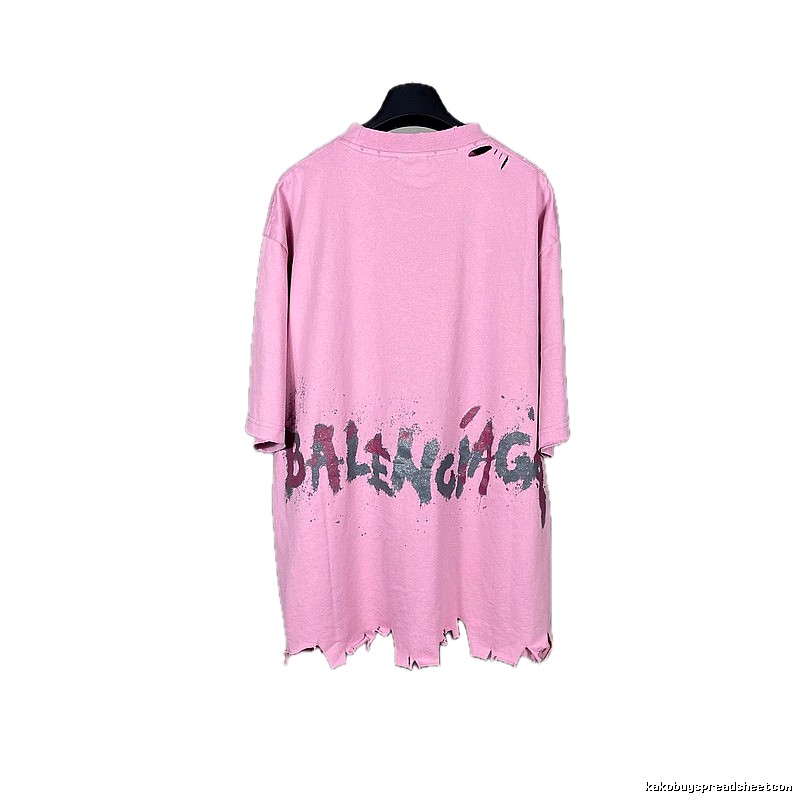 Balenciaga's pink T-shirt with a hole and graffiti style